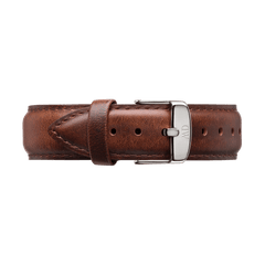Light brown genuine leather watch strap with subtle stitching, featuring a polished silver buckle engraved with the Daniel Wellington monogram, shown in an extra-long size for a comfortable and tailored fit.