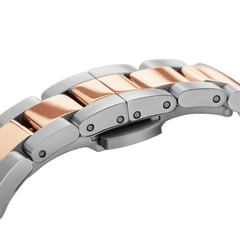 Detail of the Daniel Wellington Iconic Link Lumine adjustable bracelet, featuring polished stainless steel links with rose gold-plated centre accents.