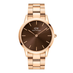 Daniel Wellington Iconic Link Amber watch with a polished rose gold stainless steel bracelet and a minimalist amber brown dial.