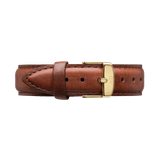 Rich brown leather watch strap with detailed stitching and a polished gold buckle engraved with subtle branding, designed for a classic and refined finish.