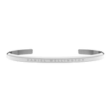 Slim silver open cuff bracelet with a polished finish and engraved Daniel Wellington logo on the front.