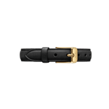 Black leather Pressed Sheffield Strap Gold with a polished gold buckle engraved with the Daniel Wellington initials, showcasing a slim, refined design and multiple adjustment holes.