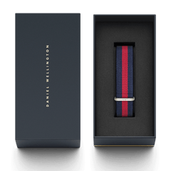 Oxford Strap Silver navy and red NATO watch strap with silver buckle, presented in a Daniel Wellington gift box.