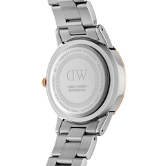 Back view of the Daniel Wellington Iconic Link Lumine watch, showing the engraved stainless steel case, serial number, and two-tone bracelet with rose gold-plated accents.