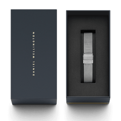 Sterling Strap Silver mesh watch strap in polished stainless steel, elegantly presented in a dark Daniel Wellington gift box with gold lettering.