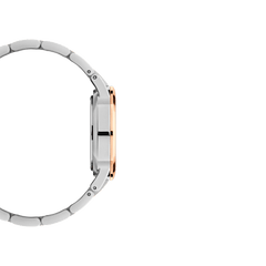 Side profile of the Iconic Link Lumine watch, highlighting its slim round case with rose gold-plated accents and a polished two-tone stainless steel bracelet.