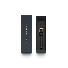 Pressed Sheffield Strap Gold displayed in a sleek navy Daniel Wellington box, featuring a slim black leather watch strap with a polished gold buckle and minimalist detailing.