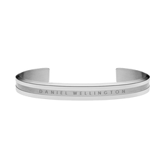 Sleek silver Daniel Wellington cuff bracelet with a polished finish, brushed centre detail, and engraved logo on the front.