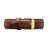 Premium brown leather watch strap with neat stitching and a gold buckle engraved with subtle branding, designed to complement Daniel Wellington timepieces.