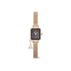 Elegant gold women’s watch with a rectangular crystal-framed case, black mother of pearl dial, gold mesh strap, and a sparkling Leo zodiac charm.