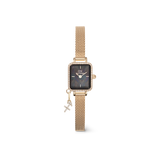 Rectangular gold women’s watch with a black mother of pearl dial, crystal-set bezel, gold mesh strap, and a sparkling Libra zodiac charm.