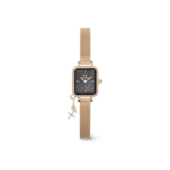 Rectangular gold women’s watch with a black mother of pearl dial, crystal-set bezel, gold mesh strap, and a sparkling Libra zodiac charm.
