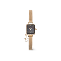 Gold rectangular women’s watch with a black mother of pearl dial, crystal-studded bezel, gold mesh strap, and a sparkling Sagittarius zodiac charm.