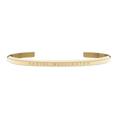 Slim gold Daniel Wellington open cuff bracelet with a polished finish and engraved logo on the front.