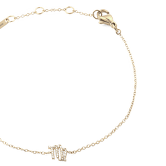 Close-up of the Crystal Zodiac Chain Bracelet Gold, featuring a slim adjustable gold chain with a sparkling crystal zodiac pendant and secure lobster clasp.