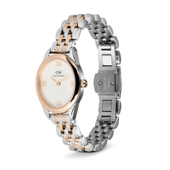 Ophelia Mini Two-Tone Rose Gold watch with an oval white dial, rose gold Roman numerals, and a polished silver and rose gold beans link bracelet, shown with an open stainless steel butterfly clasp.