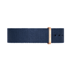 Midnight blue polyester NATO watch strap with polished rose gold buckle and keeper, featuring adjustable holes and a refined, minimalist design.