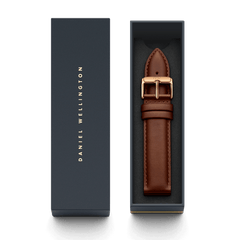 St Mawes XL Strap Rose Gold presented in a sleek Daniel Wellington gift box, featuring a light brown genuine leather strap with a polished rose gold buckle and refined stitching.