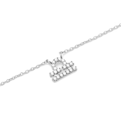 Delicate silver chain necklace featuring a Libra zodiac pendant adorned with sparkling hand-set crystals.