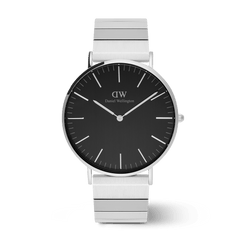 Classic Daniel Wellington watch with a brushed onyx black dial and a distinctive silver piano link strap, featuring minimalist hour markers and a sleek stainless steel finish.