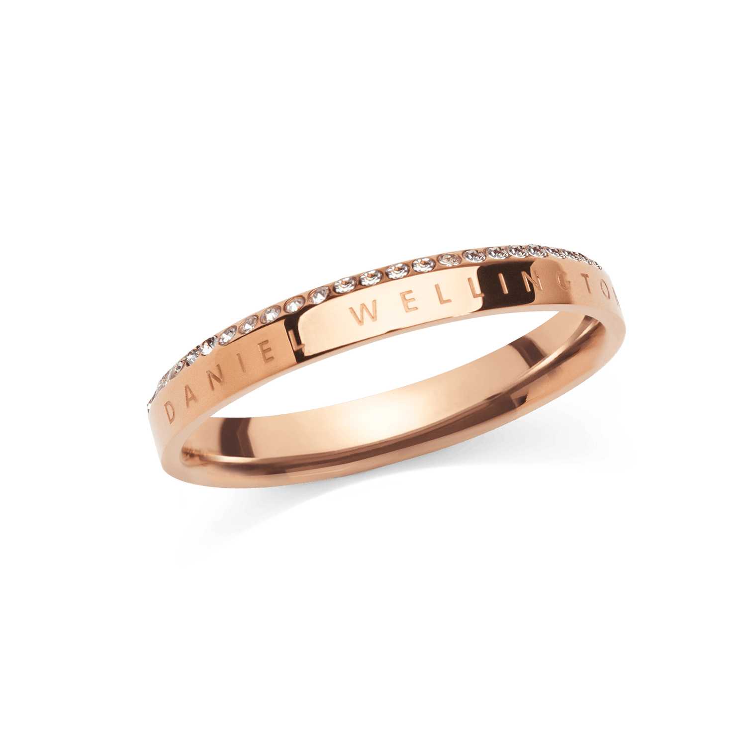 Slim rose gold ring with engraved Daniel Wellington branding and a single row of white cubic zirconia crystals set along the chamfered edge, offering a refined and elegant finish.