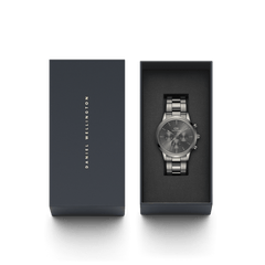Daniel Wellington Iconic Chronograph Link Graphite watch presented in a signature dark gift box, featuring a brushed stainless steel bracelet and monochrome graphite dial.