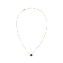 Gold necklace featuring a fine adjustable chain and a central domed malachite pendant, encircled by a delicate row of white cubic zirconia crystals for an elegant, timeless look.
