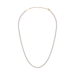 Rose gold tennis necklace featuring a row of individually set crystals, crafted from polished stainless steel with an adjustable clasp for a tailored fit. The classic, elegant design offers a refined touch suitable for both everyday wear and special occasions.