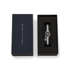 Quadro Mini Crystal Zodiac Sterling Set presented in an elegant Daniel Wellington gift box, featuring a rectangular black mother of pearl dial, crystal-set bezel, silver mesh strap, and a sparkling zodiac charm.