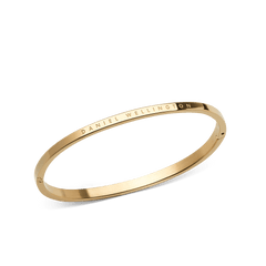 Classic Bangle Gold by Daniel Wellington, a slim polished gold bracelet with subtle engraved branding and a minimalist, elegant design.