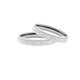 Pair of polished silver Daniel Wellington rings with minimalist band design and subtle engraved branding, presented as a matching set ideal for gifting or everyday wear.