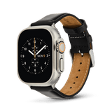 Apple Watch Ultra fitted with a Daniel Wellington Sheffield Silver leather strap, featuring smooth black leather, subtle stitching, and a polished silver buckle for a refined, classic look.