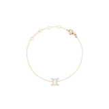 Delicate gold chain bracelet featuring a Gemini zodiac pendant adorned with sparkling crystals and an adjustable clasp.