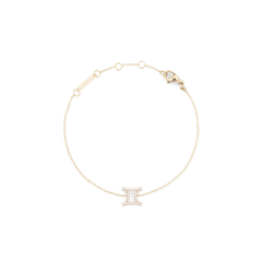Delicate gold chain bracelet featuring a Gemini zodiac pendant adorned with sparkling crystals and an adjustable clasp.