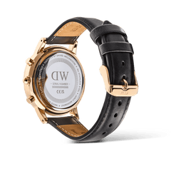 Rear view of the Daniel Wellington Iconic Chronograph Sheffield RG, showing the engraved stainless steel case back, rose gold detailing, and adjustable black leather strap with a polished buckle.