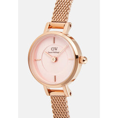 Close-up of the Petite Mini Blush Melrose watch highlighting its blush pink sunray dial, minimalist hour markers, and rose gold mesh strap.