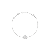Delicate silver bracelet with a round mother of pearl charm and cubic zirconia accents, adjustable fine chain.