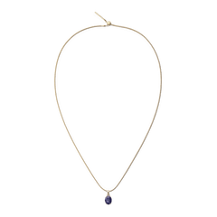 Elegant gold necklace featuring a delicate oval blue spot semi-precious stone charm with natural veining, set in a polished gold-plated frame.