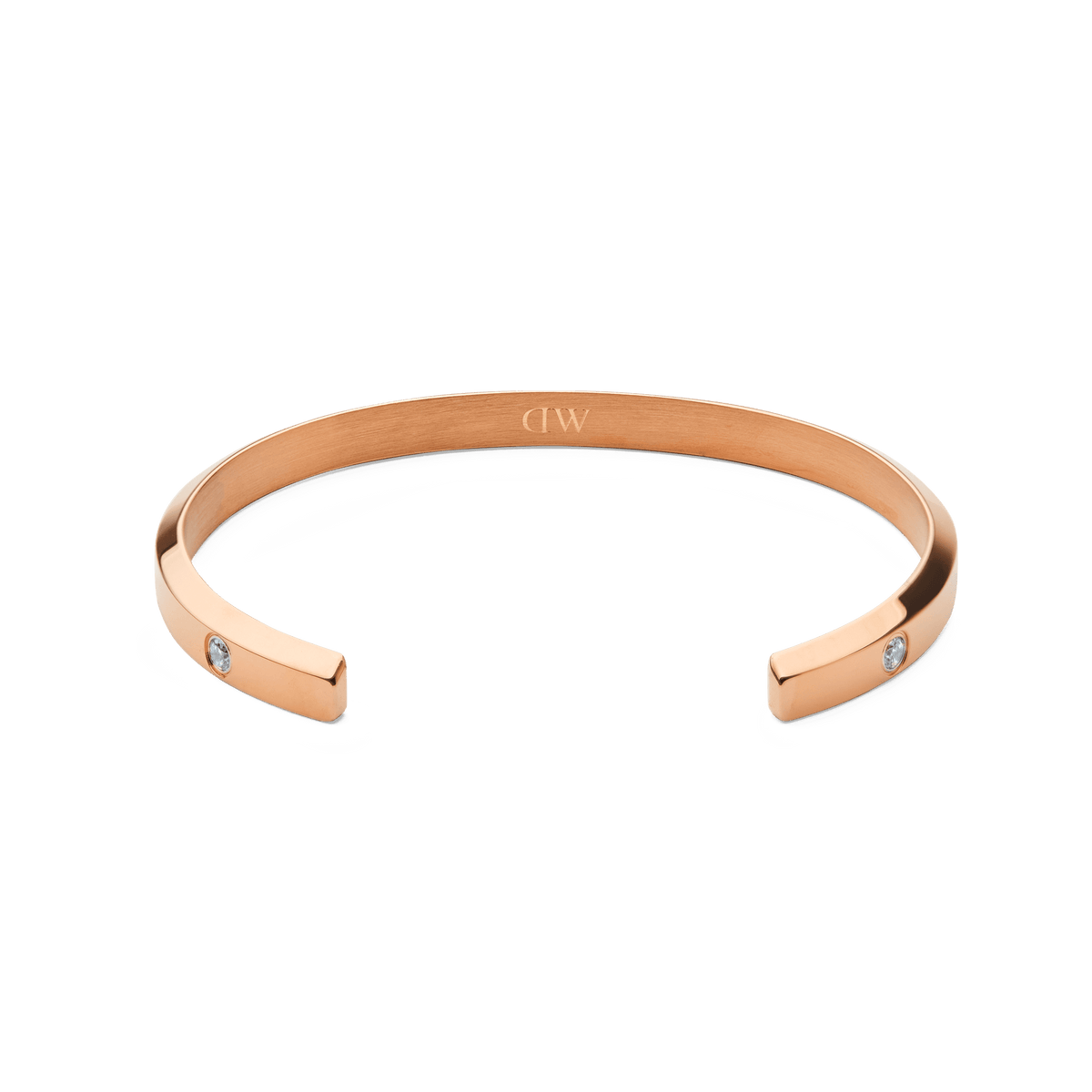 Classic Lumine Bracelet Rose Gold 55mm shown from above, highlighting its open cuff design, polished rose gold finish, and sparkling cubic zirconia crystals set at each end.