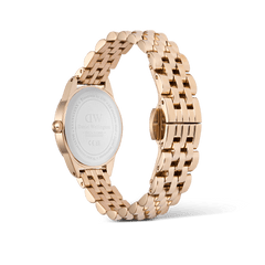 Ophelia Mini Rose Gold women’s watch shown from the back, highlighting the engraved stainless steel case and polished rose gold beans link bracelet with a butterfly clasp.