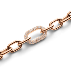 Close-up of the Crystal Link Bracelet Rose Gold, showcasing its chunky rose gold chain and a bold oval link encrusted with sparkling cubic zirconia crystals.