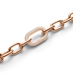 Close-up of the Crystal Link Necklace Rose Gold, highlighting the chunky rose gold chain and the central link encrusted with sparkling cubic zirconia crystals for an elegant, modern finish.