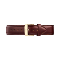 Brown leather watch strap with a tapered silhouette, featuring contrast stitching and a polished gold pin buckle engraved with the Daniel Wellington logo. The strap showcases a smooth finish and quick-release connector for easy attachment.