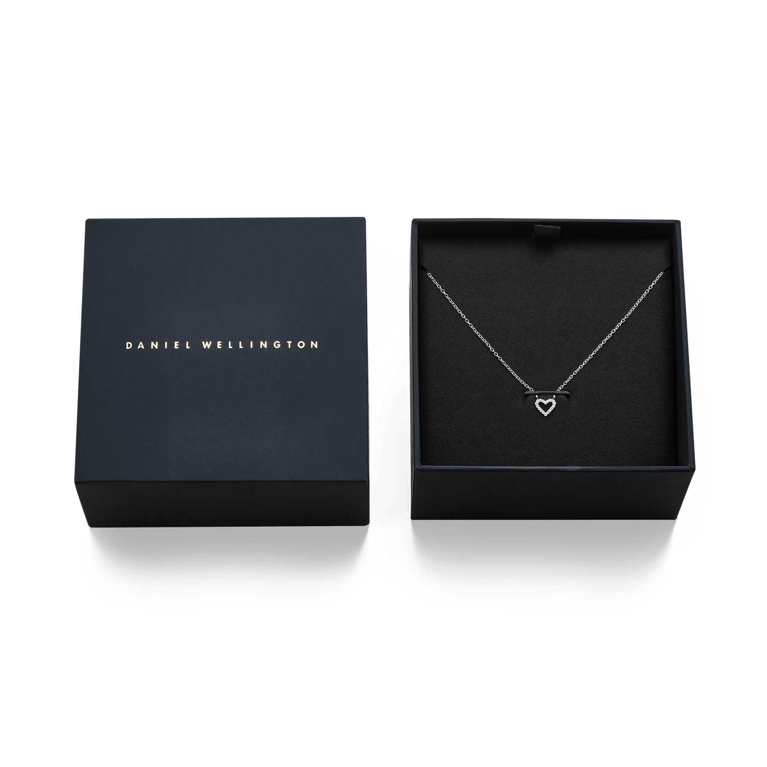 Mirelle Heart Necklace Silver displayed in an elegant Daniel Wellington gift box, featuring a delicate silver chain and an open heart pendant set with sparkling cubic zirconia.