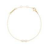 Delicate gold chain bracelet featuring a minimalist infinity symbol set with white cubic zirconia crystals, crafted from 316L stainless steel with a PVD gold finish and an adjustable clasp for a tailored fit.