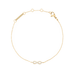 Delicate gold chain bracelet featuring a minimalist infinity symbol set with white cubic zirconia crystals, crafted from 316L stainless steel with a PVD gold finish and an adjustable clasp for a tailored fit.