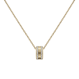 Gold Elan Lumine Necklace featuring a fine cable chain and a central ring pendant with crystal detailing on both sides, offering a minimalist and elegant look.
