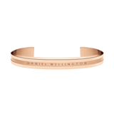 Open cuff Elan Bracelet in rose gold by Daniel Wellington, featuring a minimalist design with engraved branding and a polished finish.