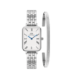 Rectangular silver Daniel Wellington watch with a white dial, Roman numeral hour markers, blue hands and a five-link bracelet, paired with a polished silver Classic Lumine bracelet featuring engraved details and sparkling accents.