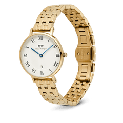 Petite Roman Numerals Date 5-link Gold watch featuring a polished gold five-link bracelet, white guilloché dial with black Roman numerals, blue hands, and a date window at 6 o’clock.